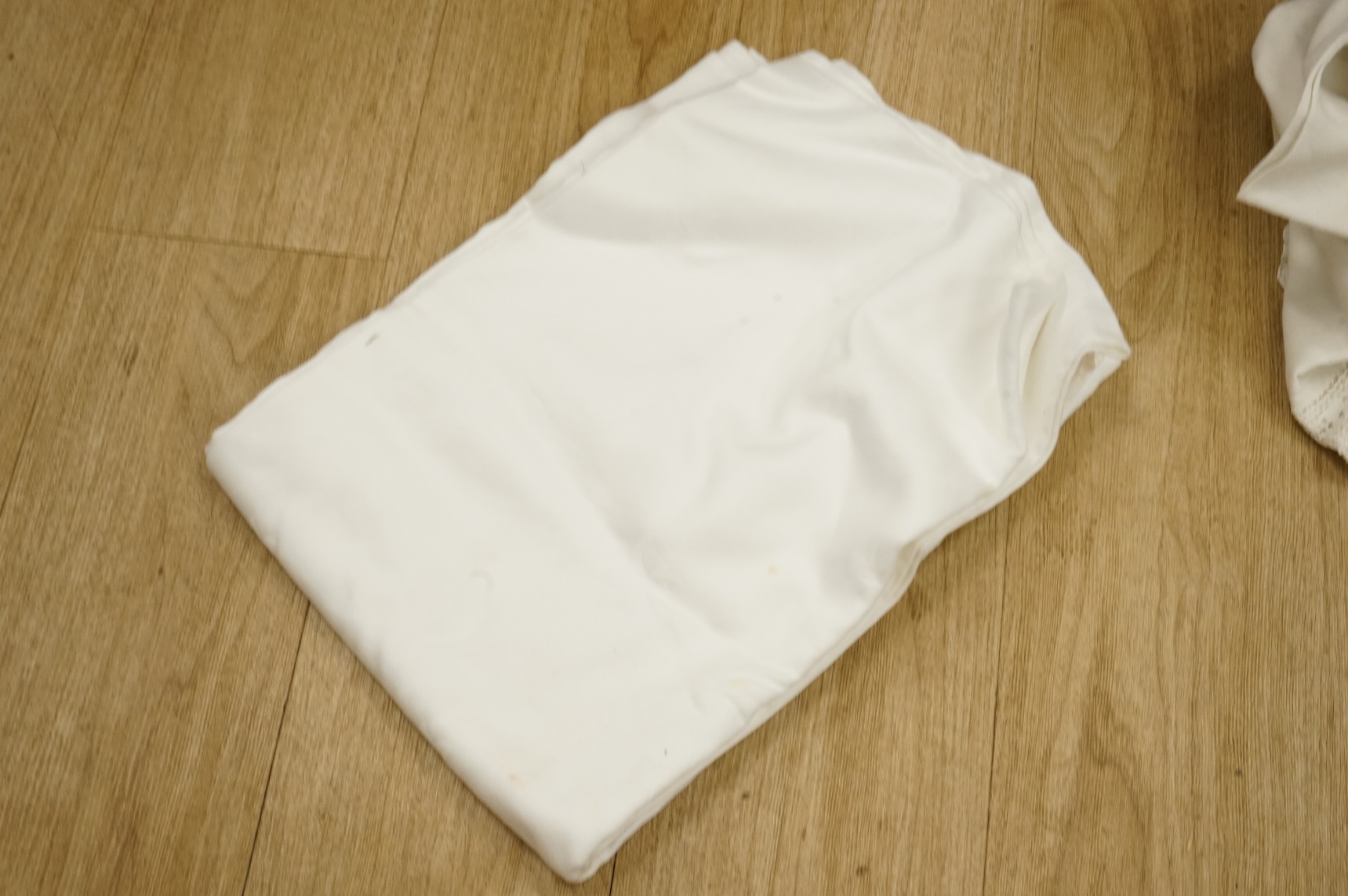 A collection of crochet, embroidered and damask linen table cloths and napkins